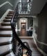 view from bottom of luxury staircase interior design feature from regent's park townhouse project