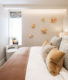 luxury bedroom interior design with cream and gold wall accessory from london riverside apartment project