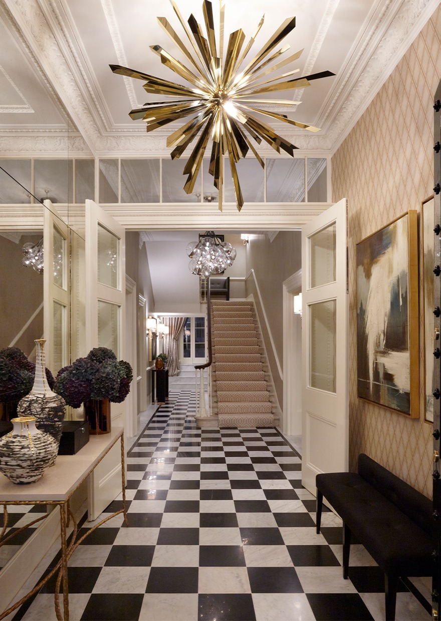 Chequered hallway with gold chandelier