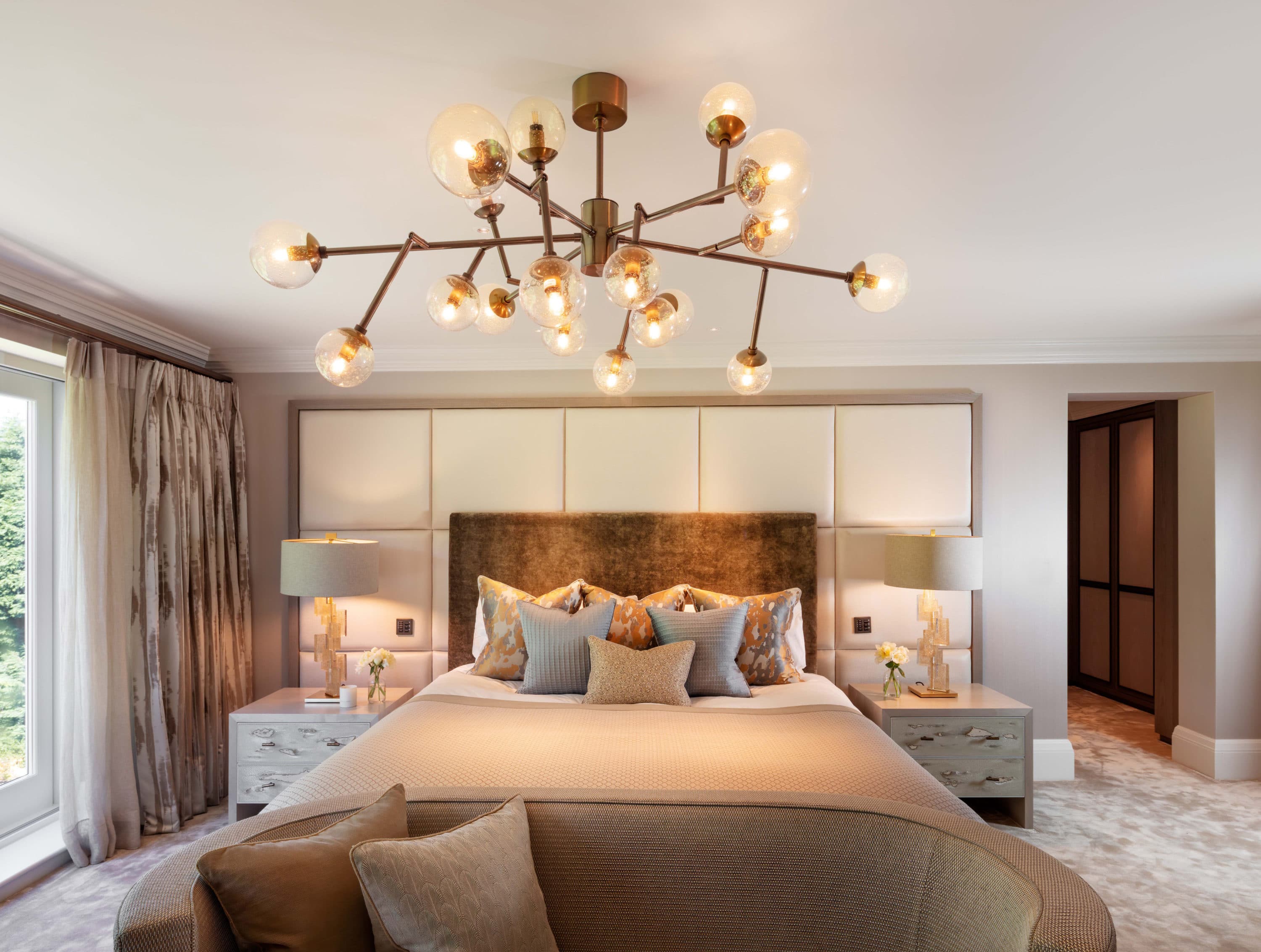 Chandelier above a king size bed