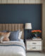 Dark blue bedroom with bespoke bed and bedside tables