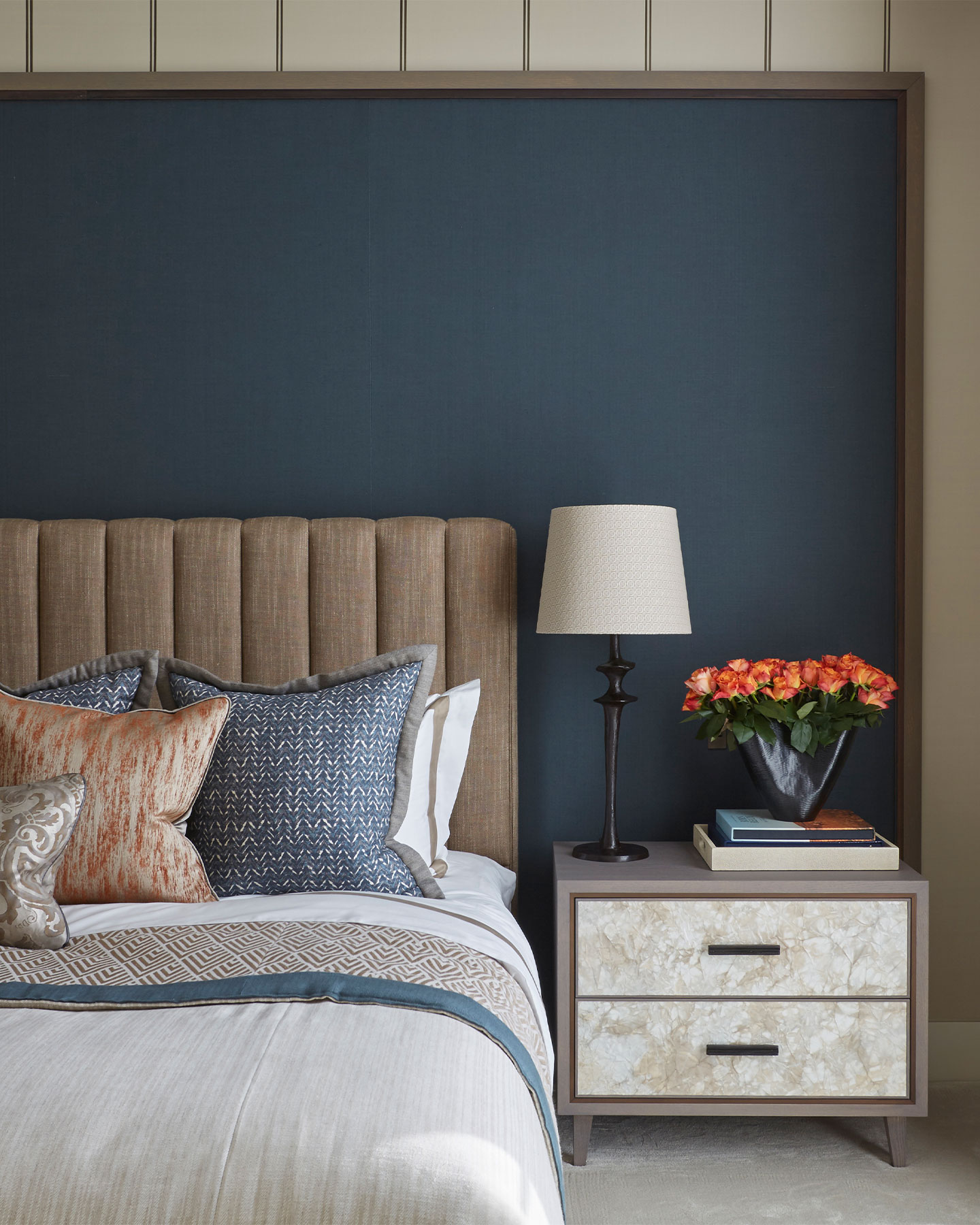 Dark blue bedroom with bespoke bed and bedside tables